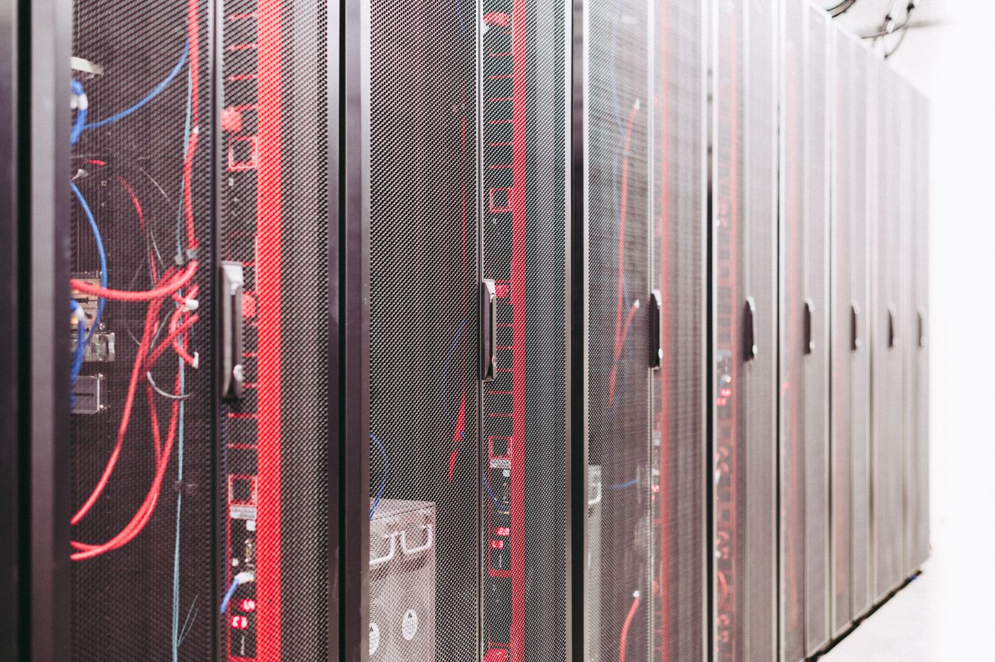Server racks with their cabling in a data centre